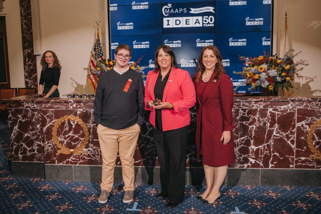 
Student Ambassador Jacob from Cotting School presents an IDEA Award to Lt. Governor Kim Driscoll, pictured with MAAPS Executive Director Elizabeth Becker.