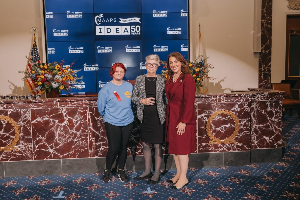 Student Ambassador Jade from Saint Ann's Home and School presents an IDEA Award to State Representative Alice H. Peisch, pictured with MAAPS Executive Director, Elizabeth Becker.