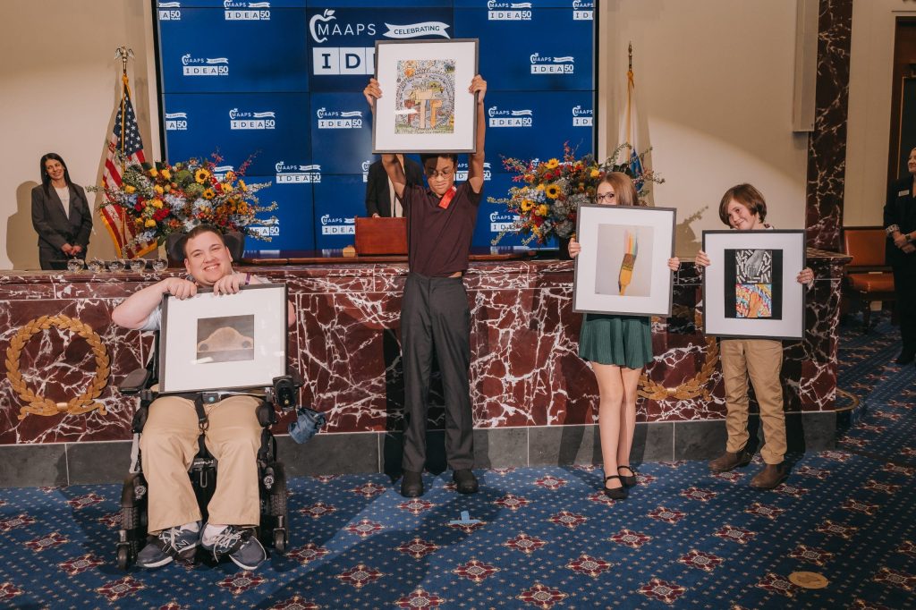 Student Ambassadors Jacob from Cotting School, Devean and Lola from Merrimac Heights Academy, and Oliver from Dr. Franklin Perkins School at RFK Community Alliance, winners of the "I'm the I in IDEA" student art contest.